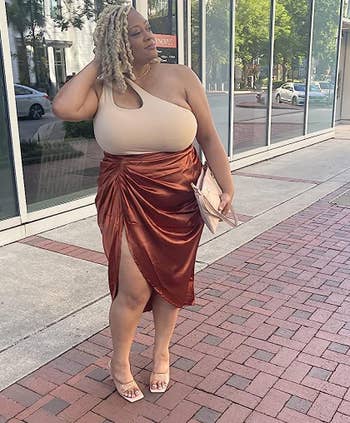 Reviewer wearing the camel skirt