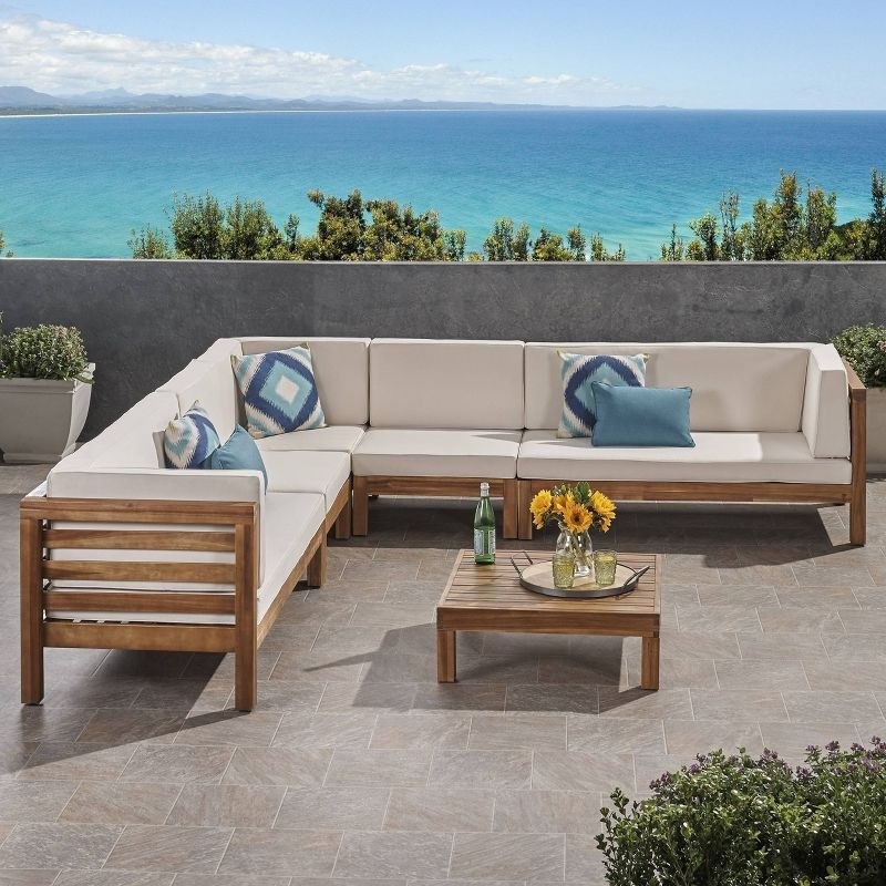 the sectional set in beige on a terrace