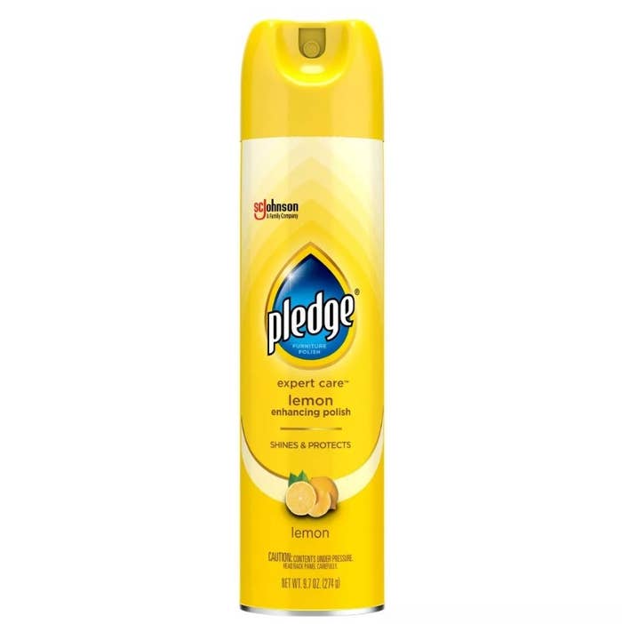 The yellow Pledge enhancing polish spray bottle