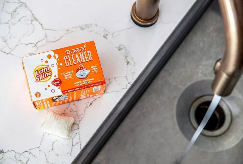 The garbage disposal cleaner in the box at the side of the sink