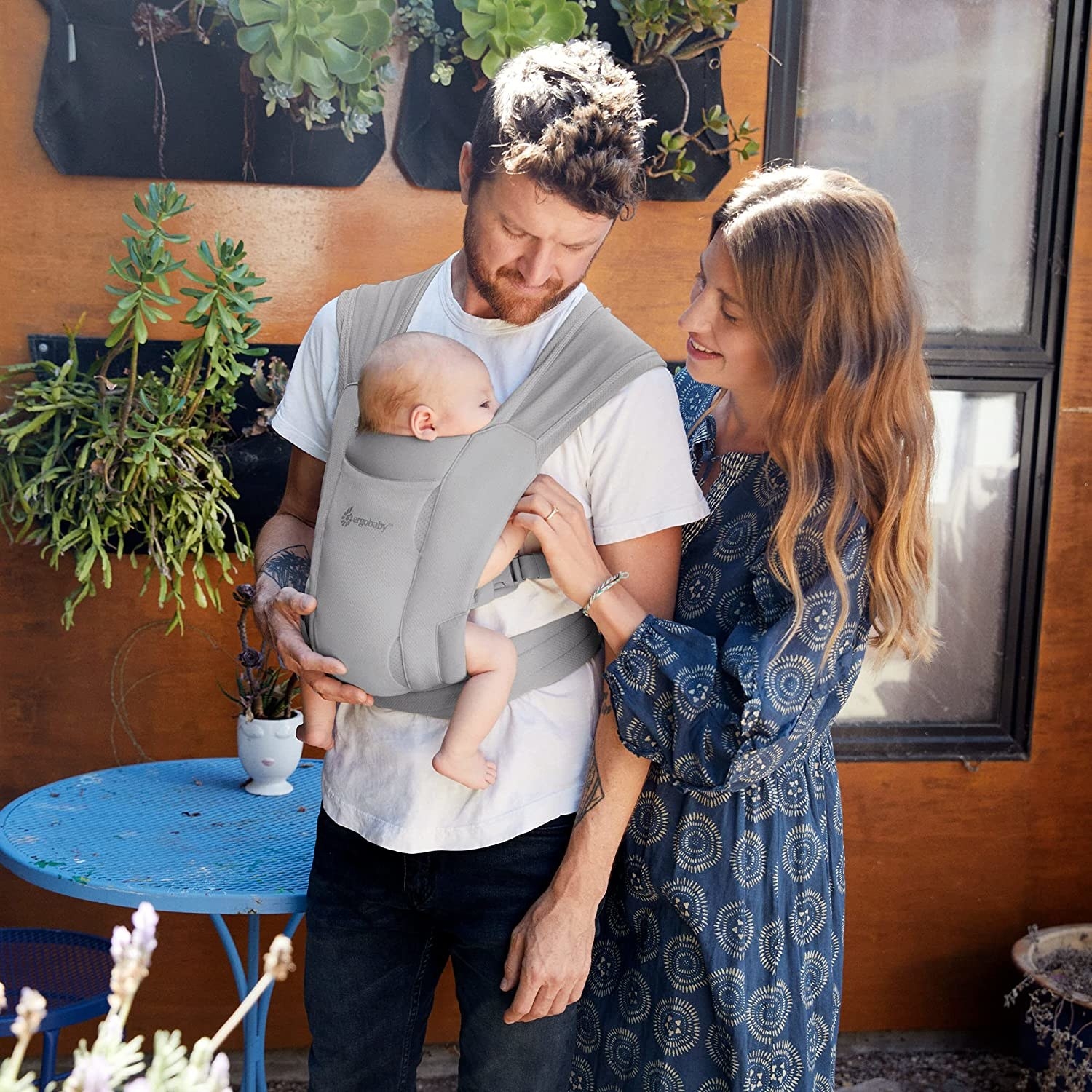 A person wearing the baby wrap carrier with a baby in it
