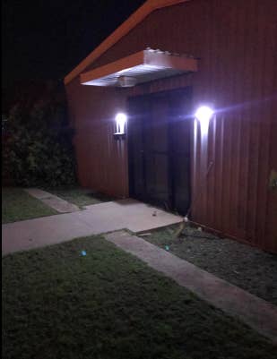 Two lights on either side of a reviewer's garage door