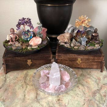 the crystal next to other crystals and spiritual decor