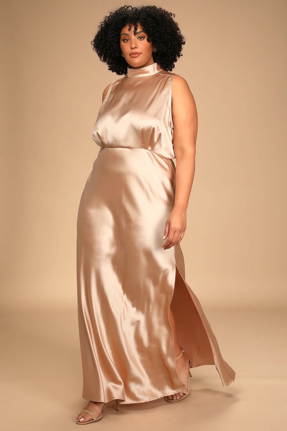 A model wearing a champagne dress