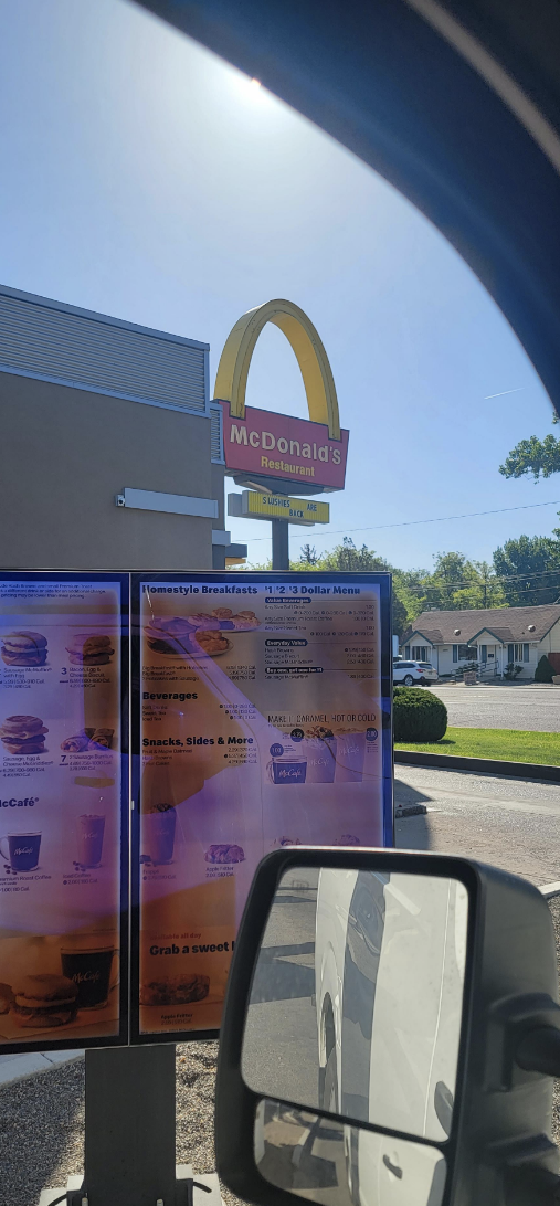 A McDonald&#x27;s sign with one arch