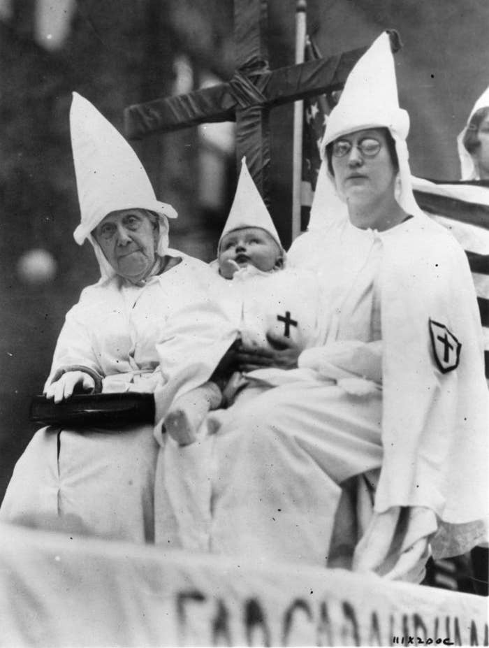 People dressed in KKK garb