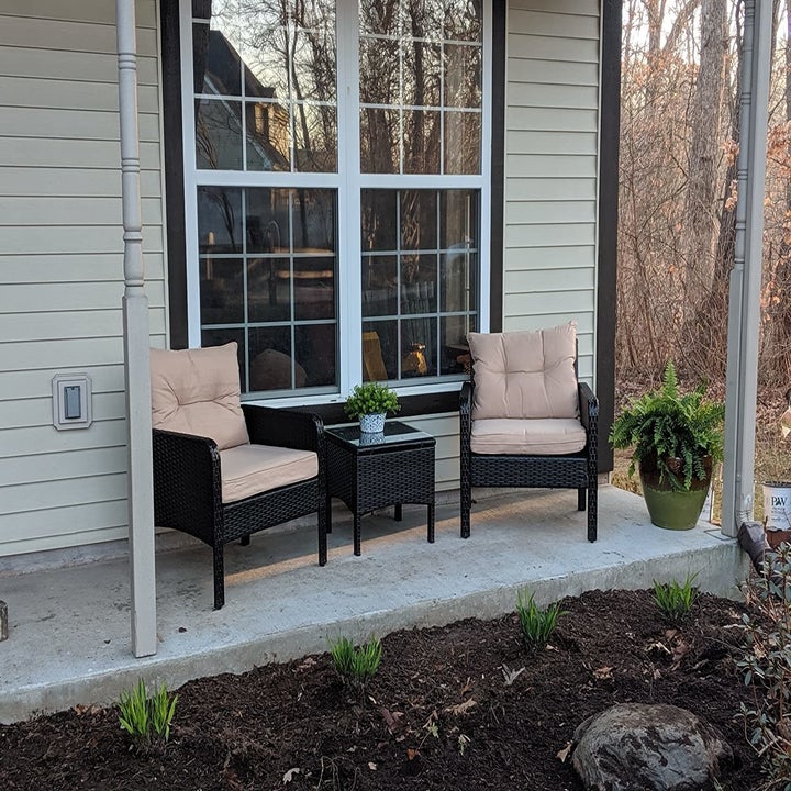 Reviewer image of the outdoor chairs and table in front of their house