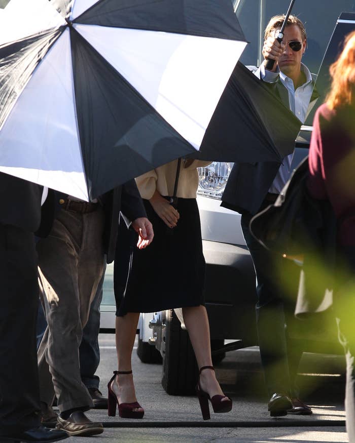 A woman behind umbrellas