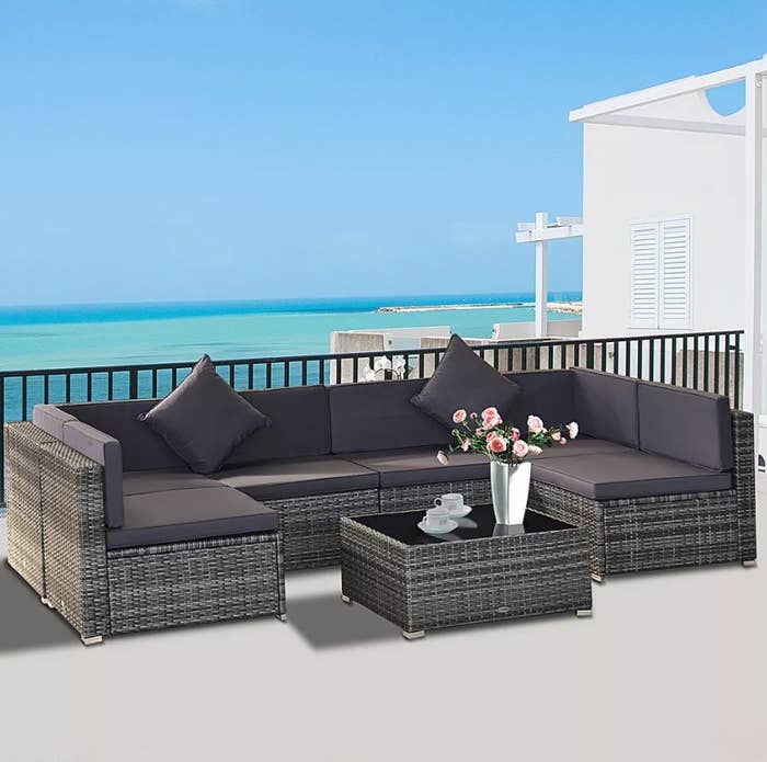The dark brown and dark grey 7 piece patio furniture set