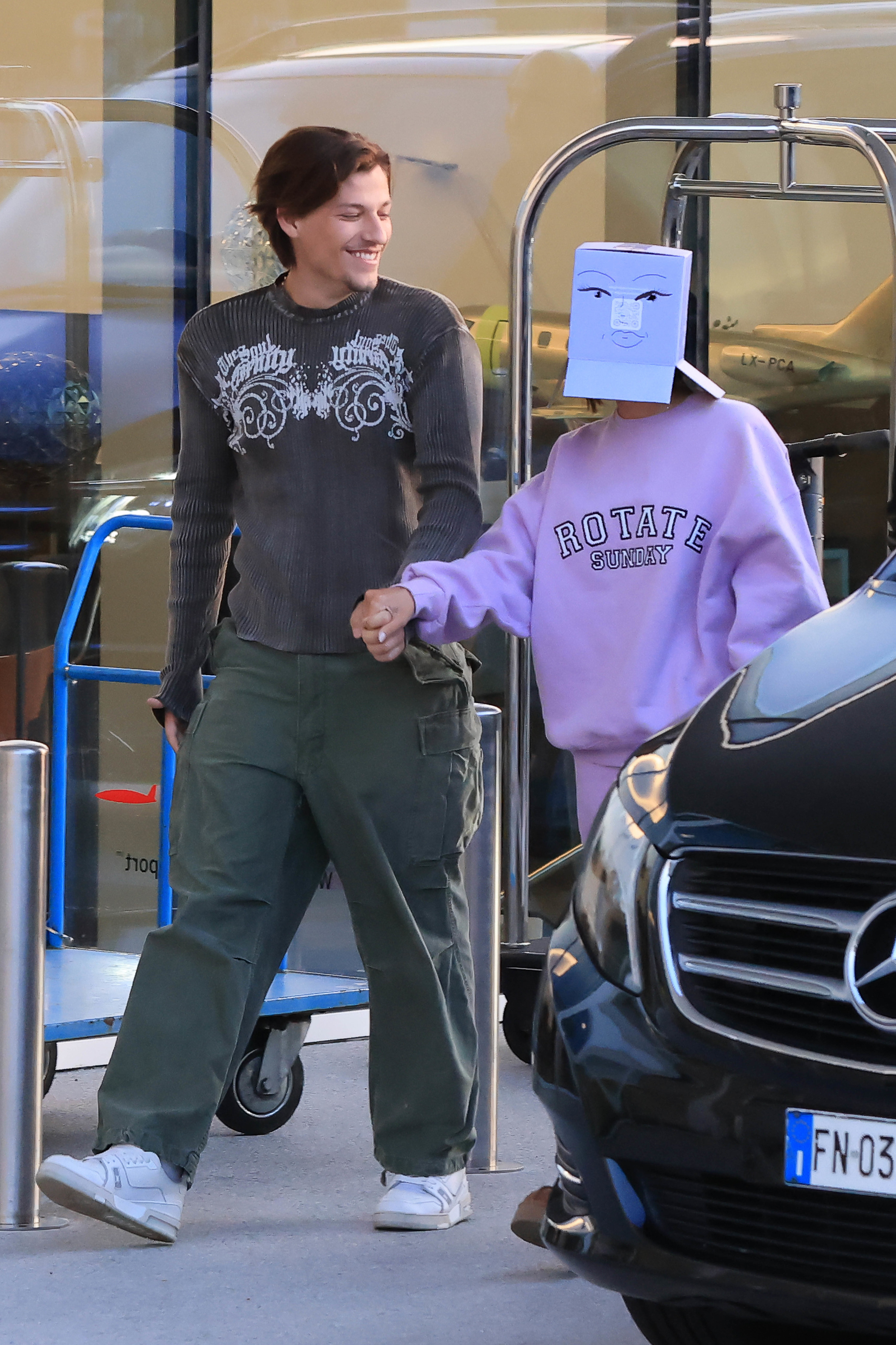 Millie Bobby Brown with a box on her head