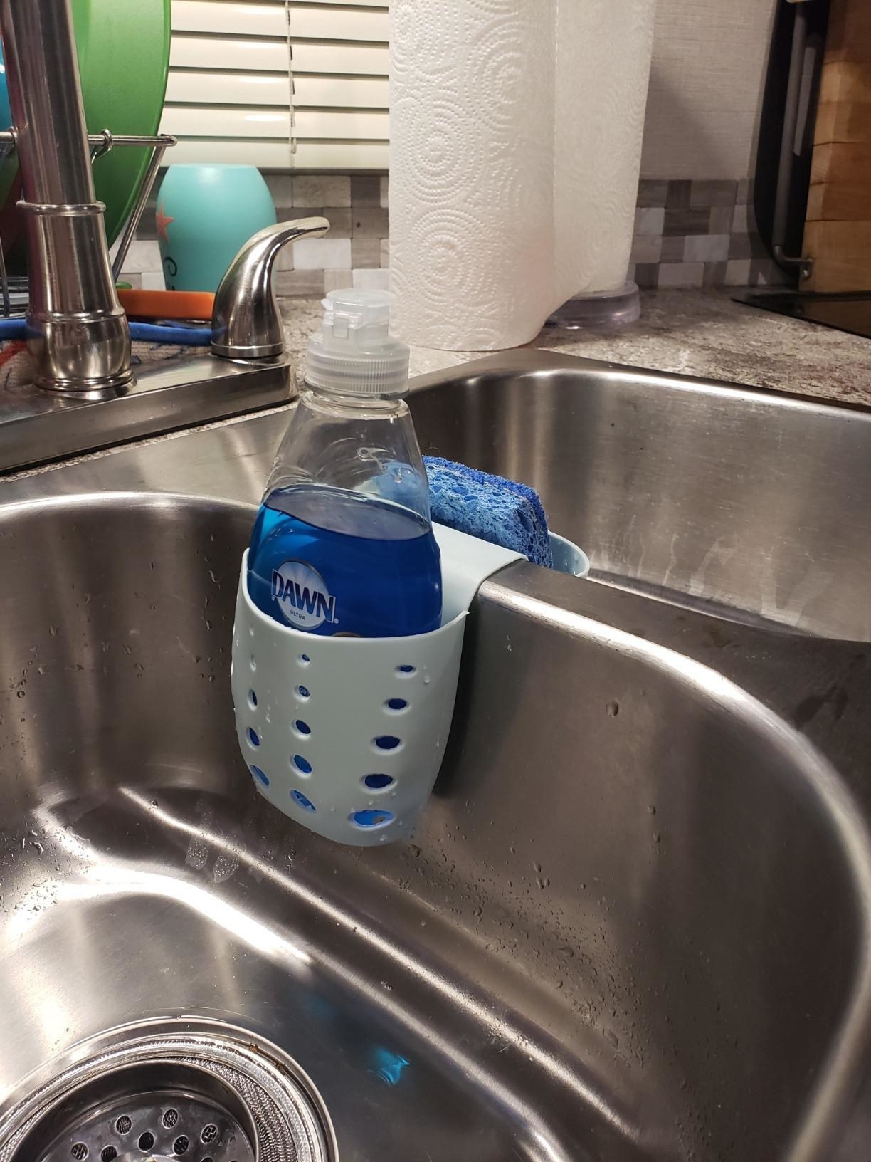 Reviewer image of the sponge holder with a small bottle of dish detergent