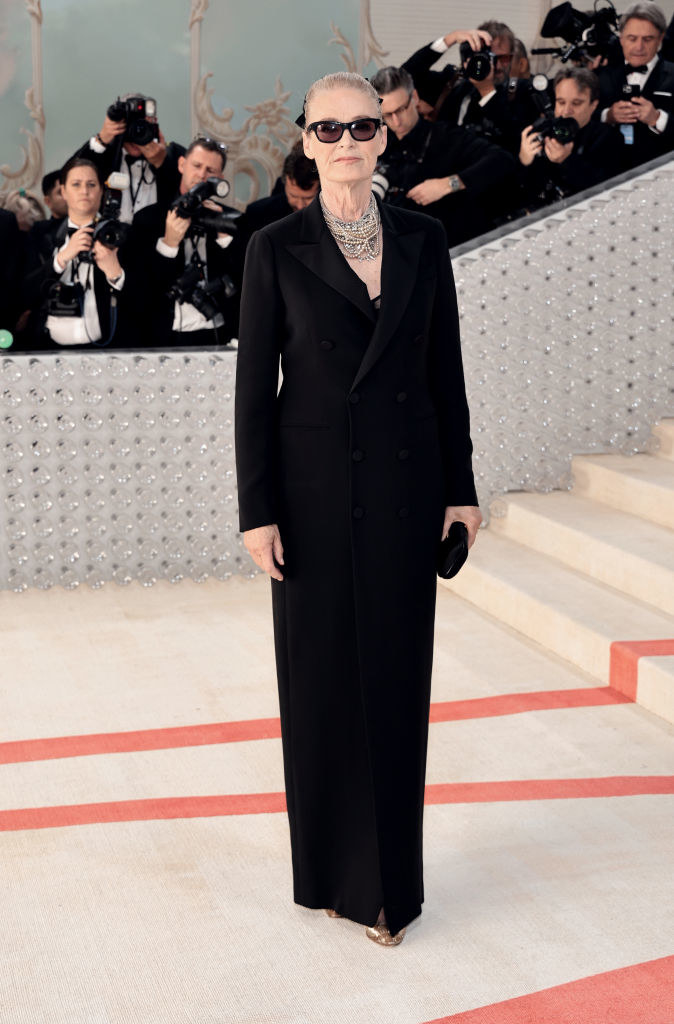 Lisa Love attends The 2023 Met Gala in a black floor length gown with buttoned blazer
