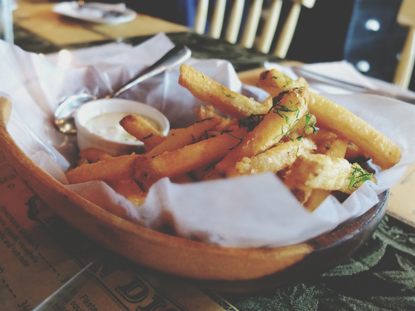 Close-Up Of Truffle Fries On Restaurant Table.