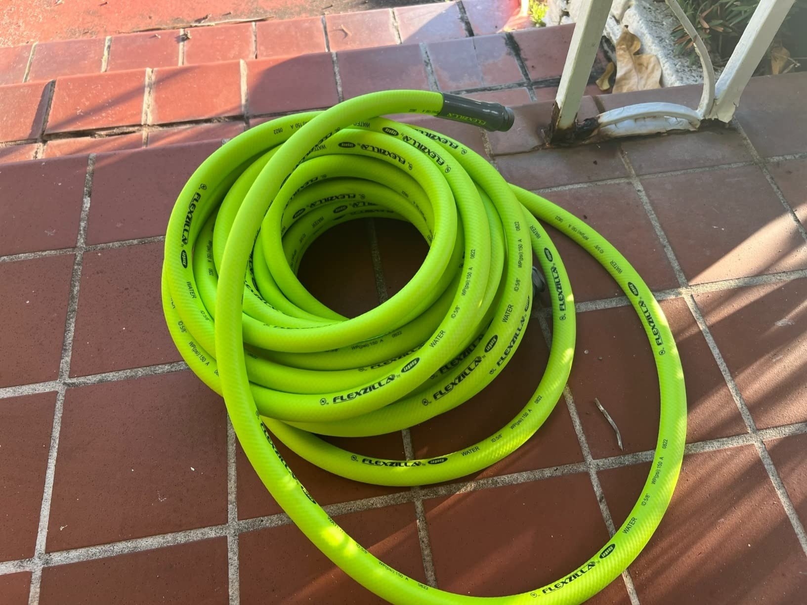 a reviewer photo of the lime green hose