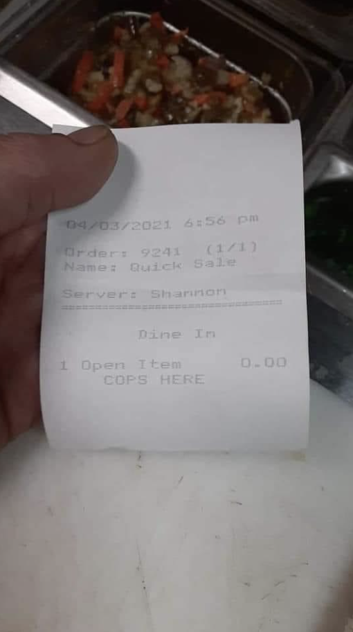 A slip that says "COPS HERE"