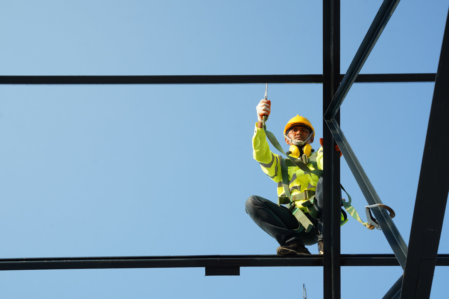 A construction worker working on scaffolding