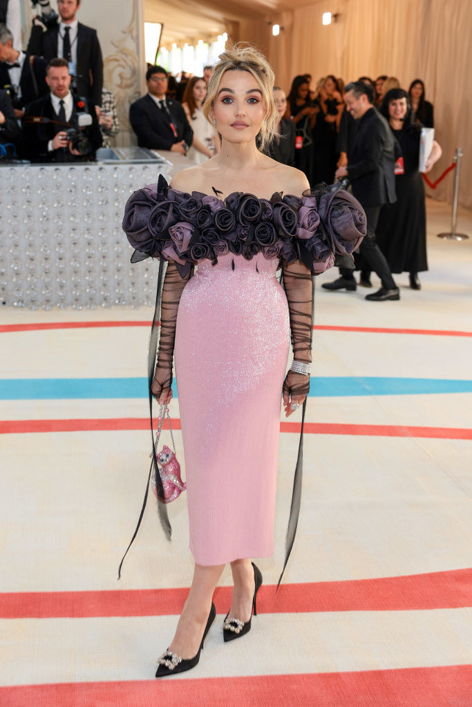 Chloe Fineman attends The 2023 Met Gala in an ankle-length gon with a floral bust