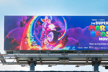 General view of a "Super Mario Bros. Movie" billboard featuring Princess Peach
