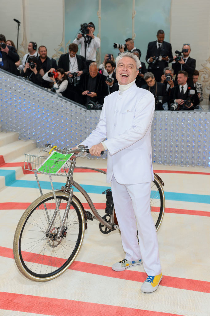 David Byrne attends The 2023 Met Gala on a white bike