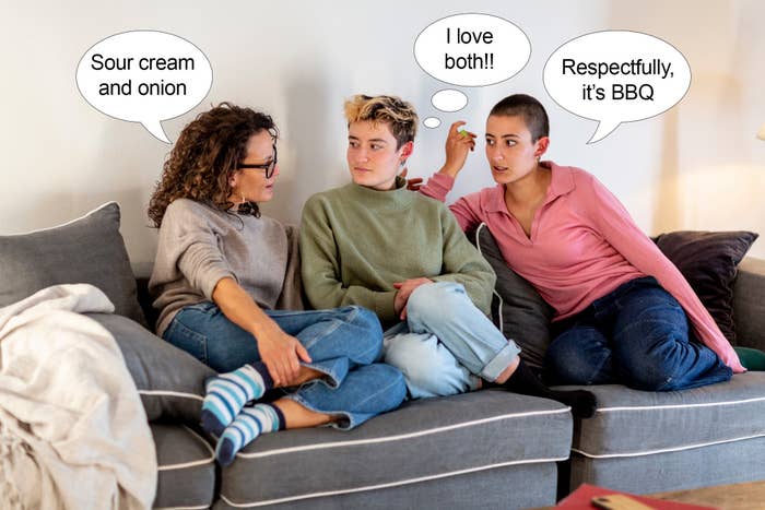 Three friends have a conversation on a couch