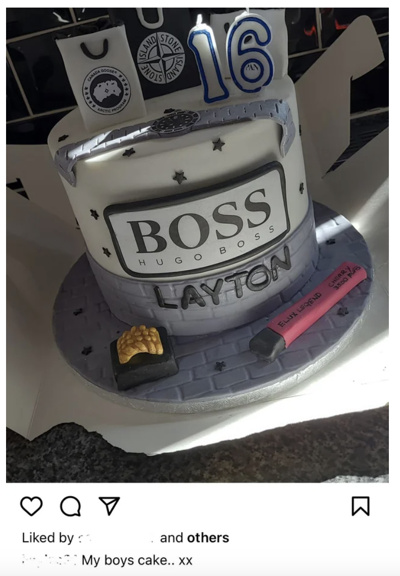 hugo boss cake and an e-cig prop on the side