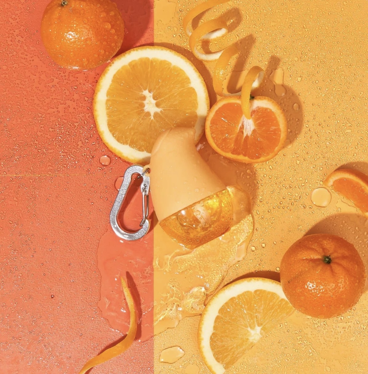 the clip on hand sanitizer in orange