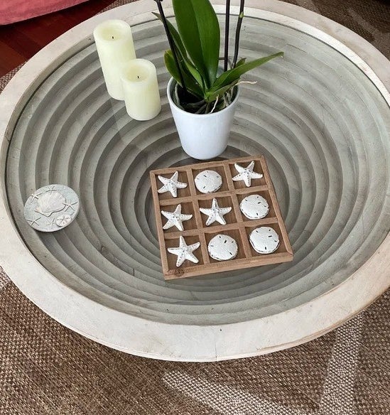 A reviewer photo of the tic-tac-toe set on a table