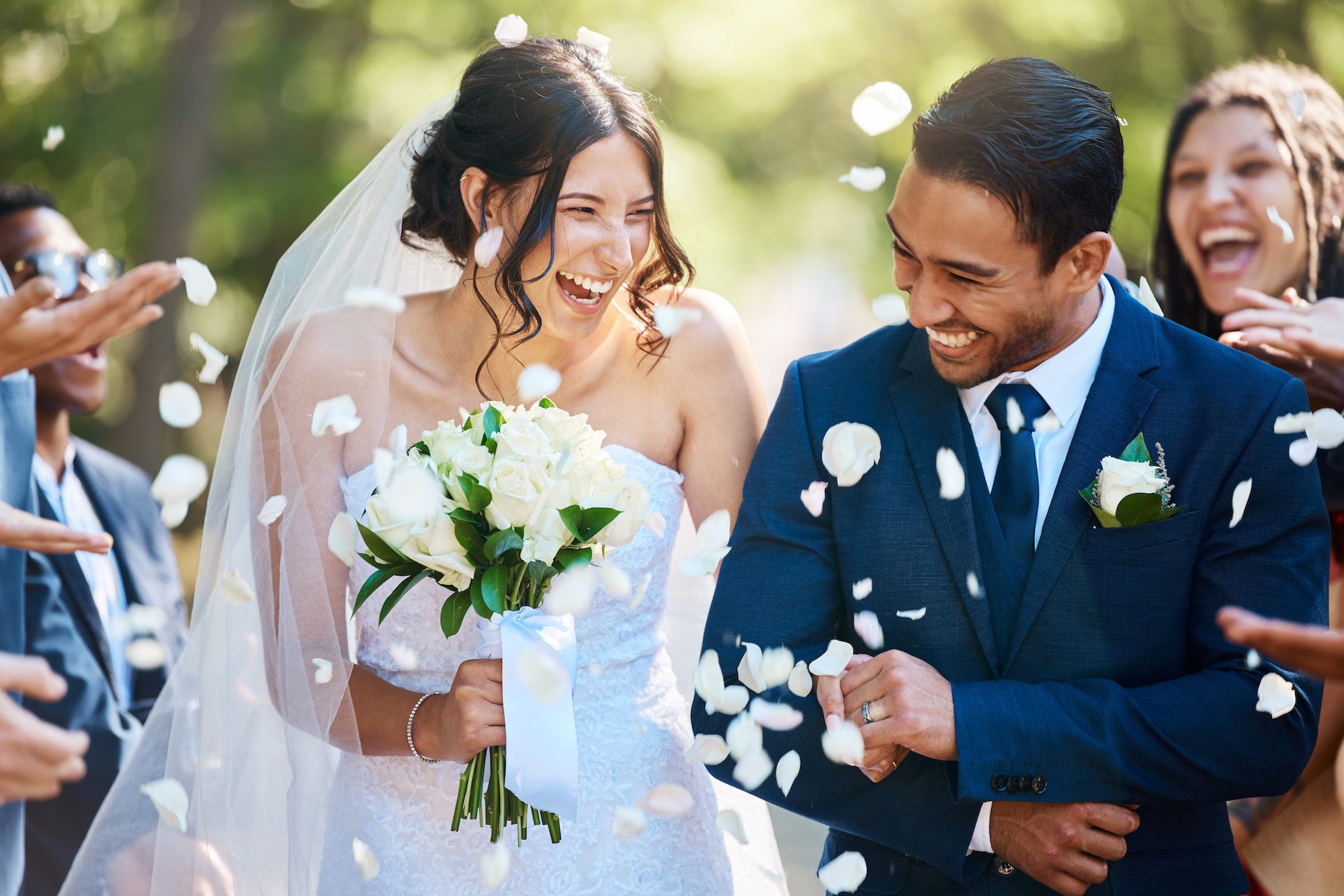 A bride and groom celebrating and smiling on their wedding day