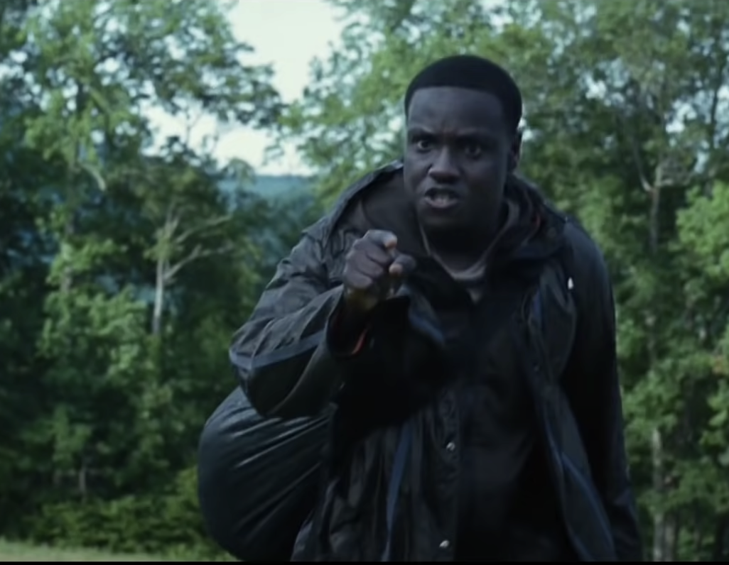 Thresh pointing at Katniss angrily