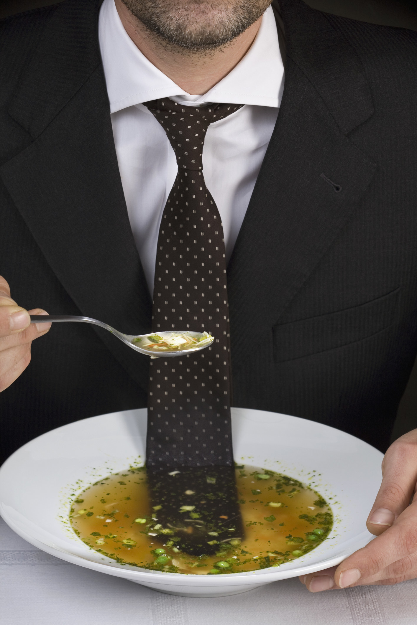 man&#x27;s tie in a bowl of soup