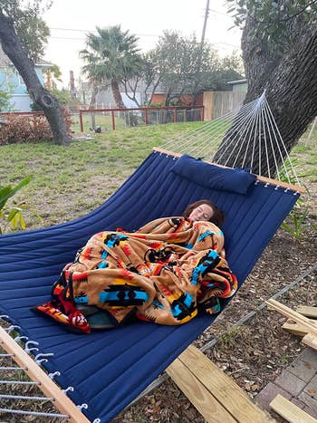Reviewer takes a nap in their blue hammock