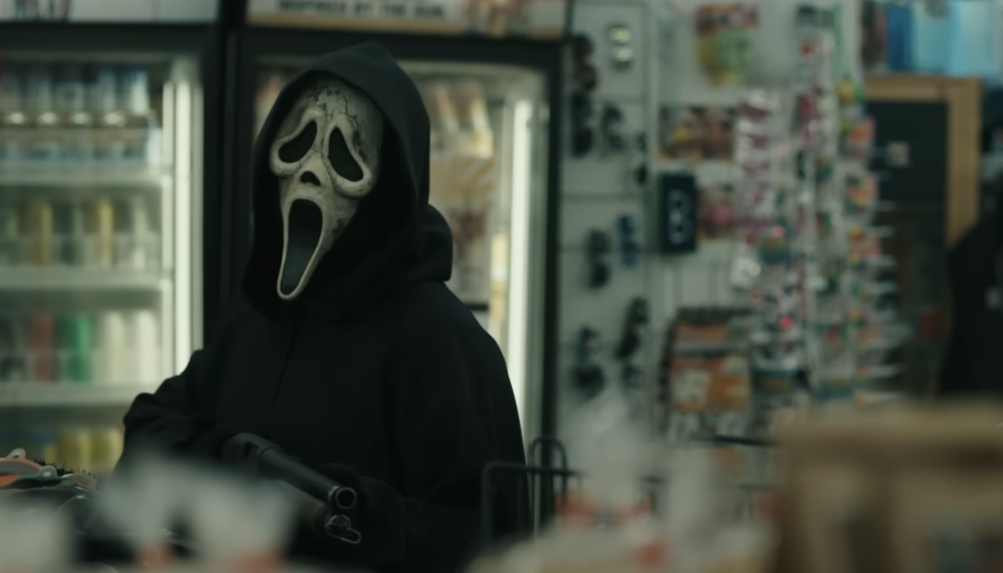 Ghostface wields a sawed-off shotgun in a bodega