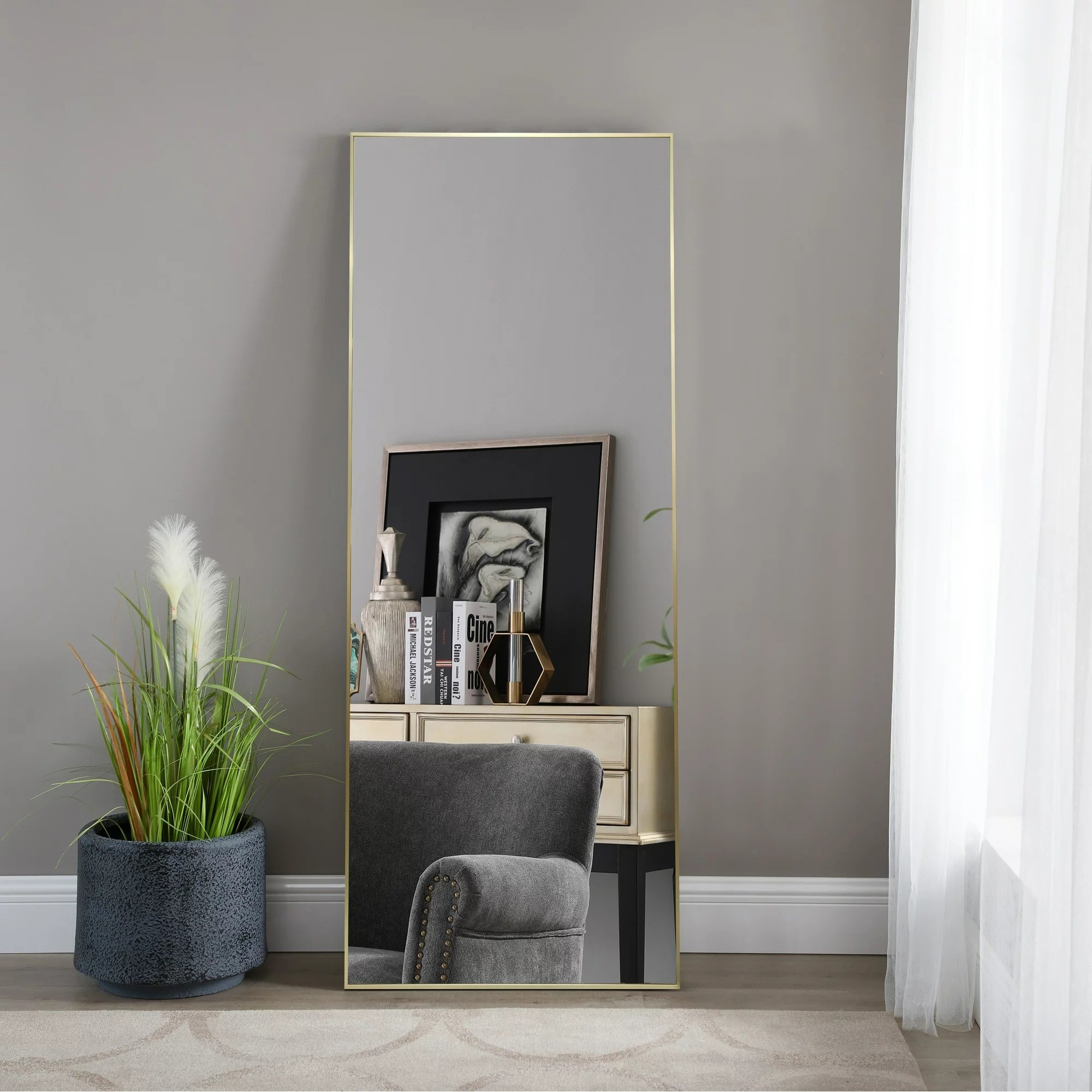 Large rectangular floor mirror with gold trim