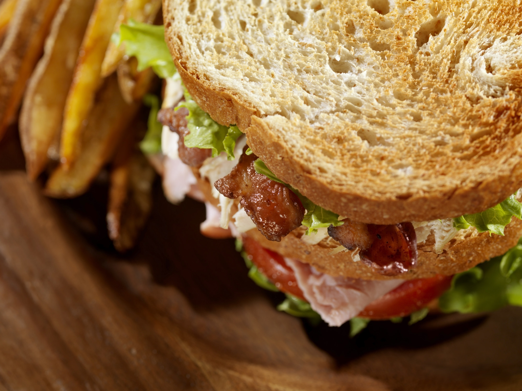 A club sandwich and fries.