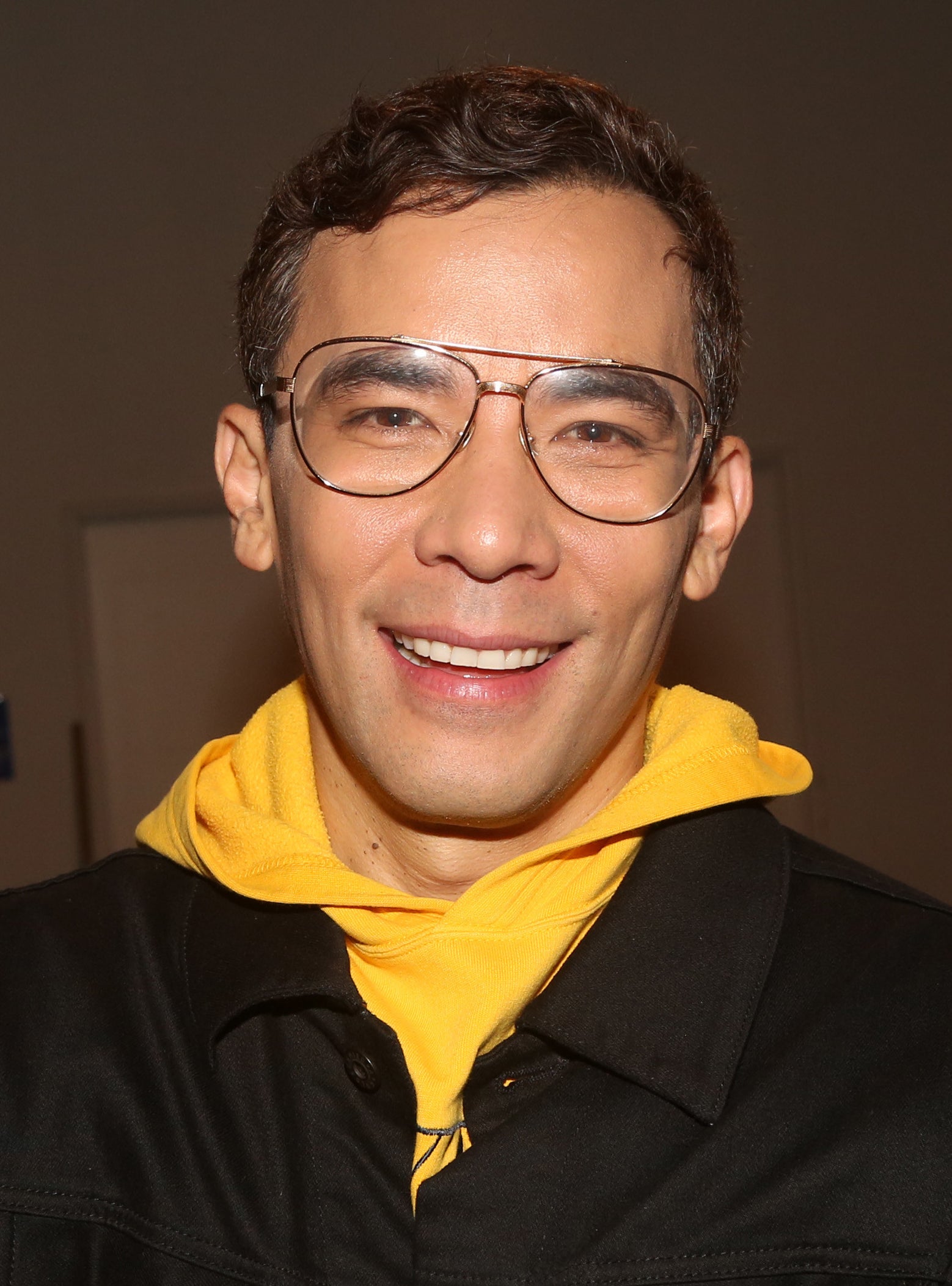 Close-up of Conrad Ricamora smiling
