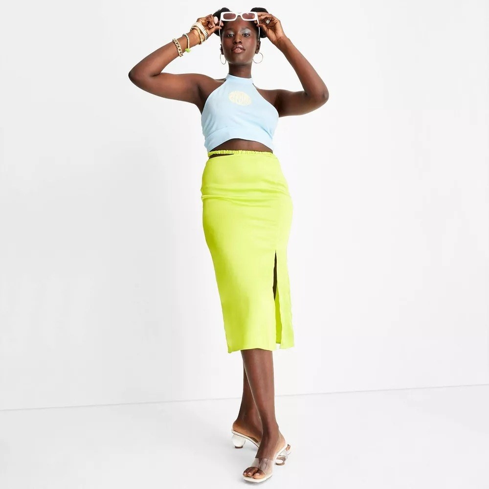 A model in the neon yellow pencil skirt