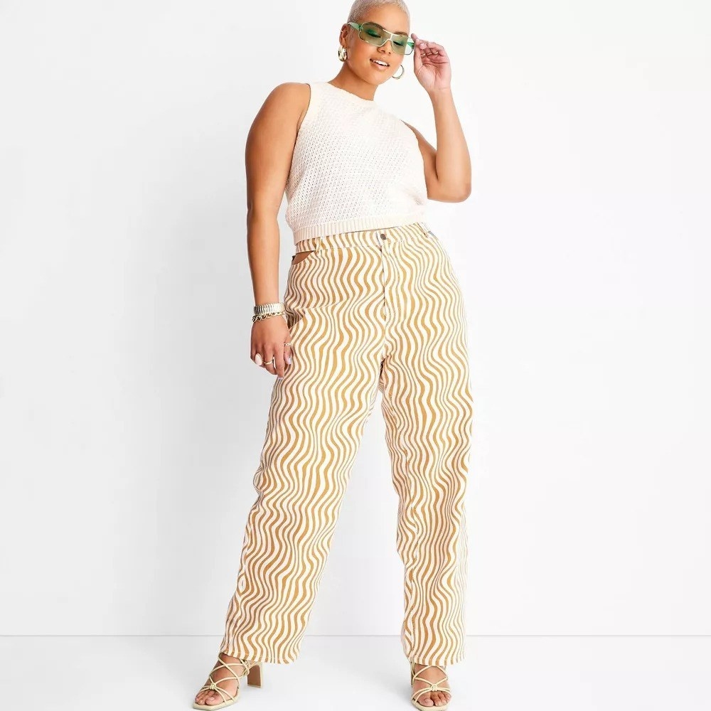 A model in the saffron and white striped pants