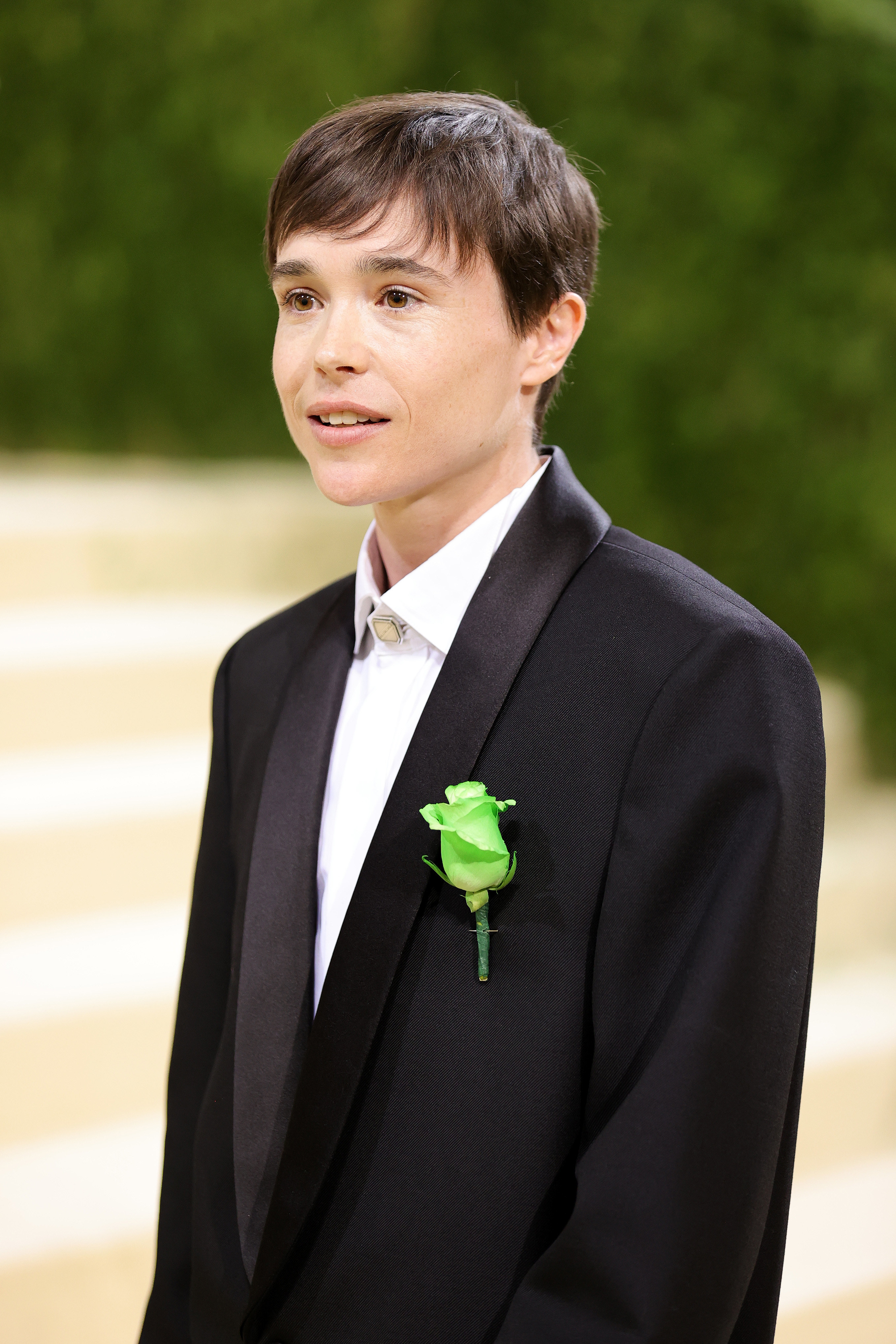 Close-up of Elliot in a suit and corsage