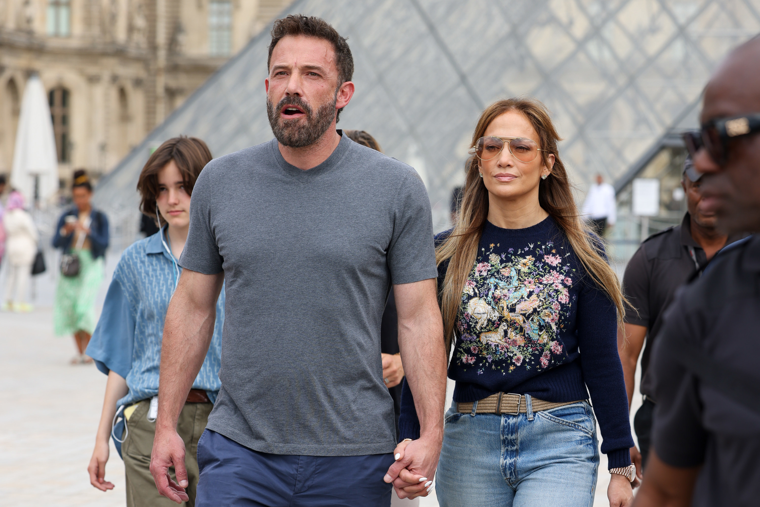 the couple holding hands in paris