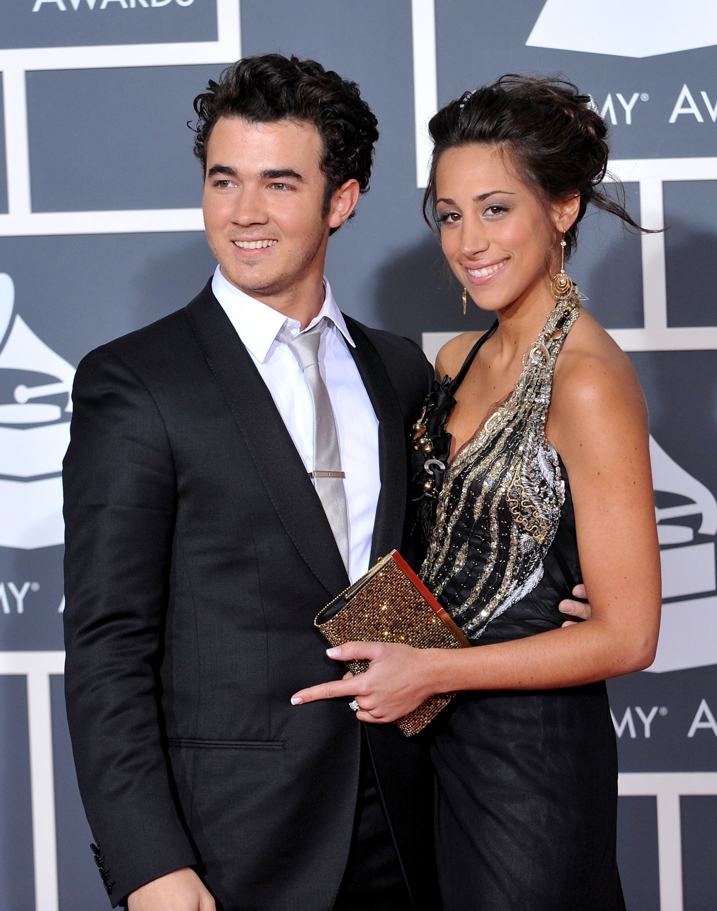 Kevin with his arm around Danielle&#x27;s waist