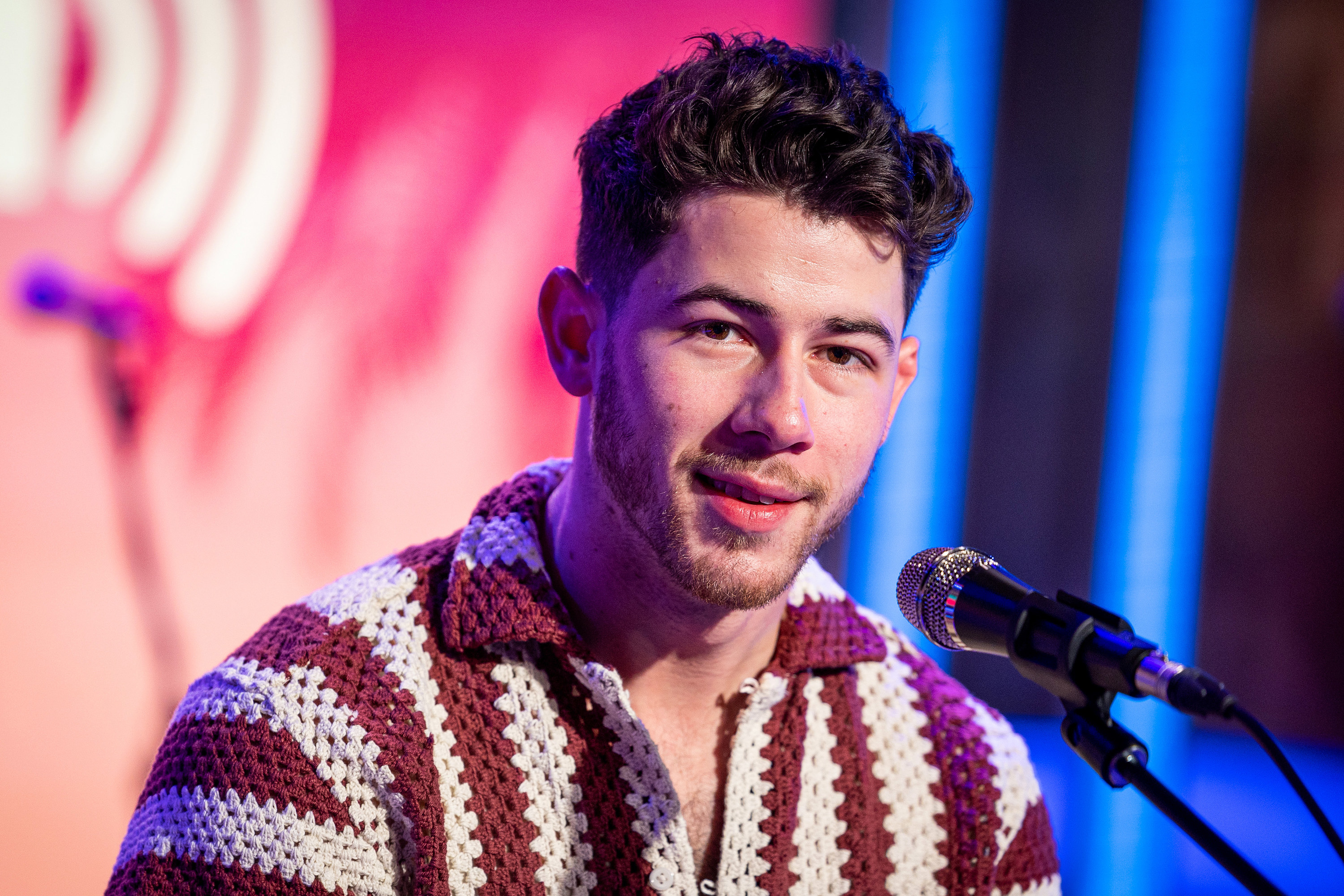 Nick in front of a microphone