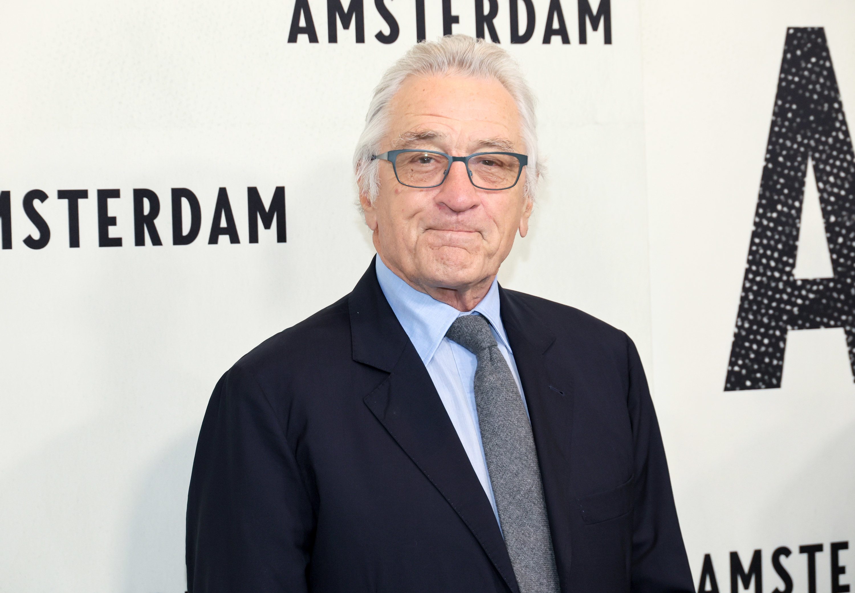 Close-up of Robert in a suit and tie on the red carpet