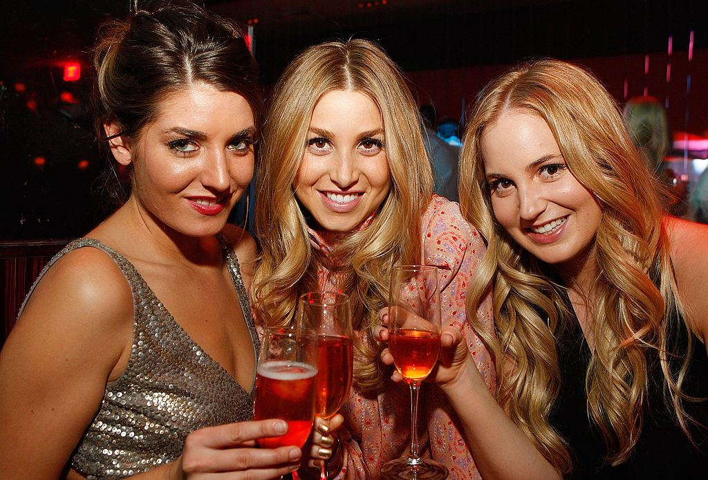 Whitney Port with two friends holding drinks