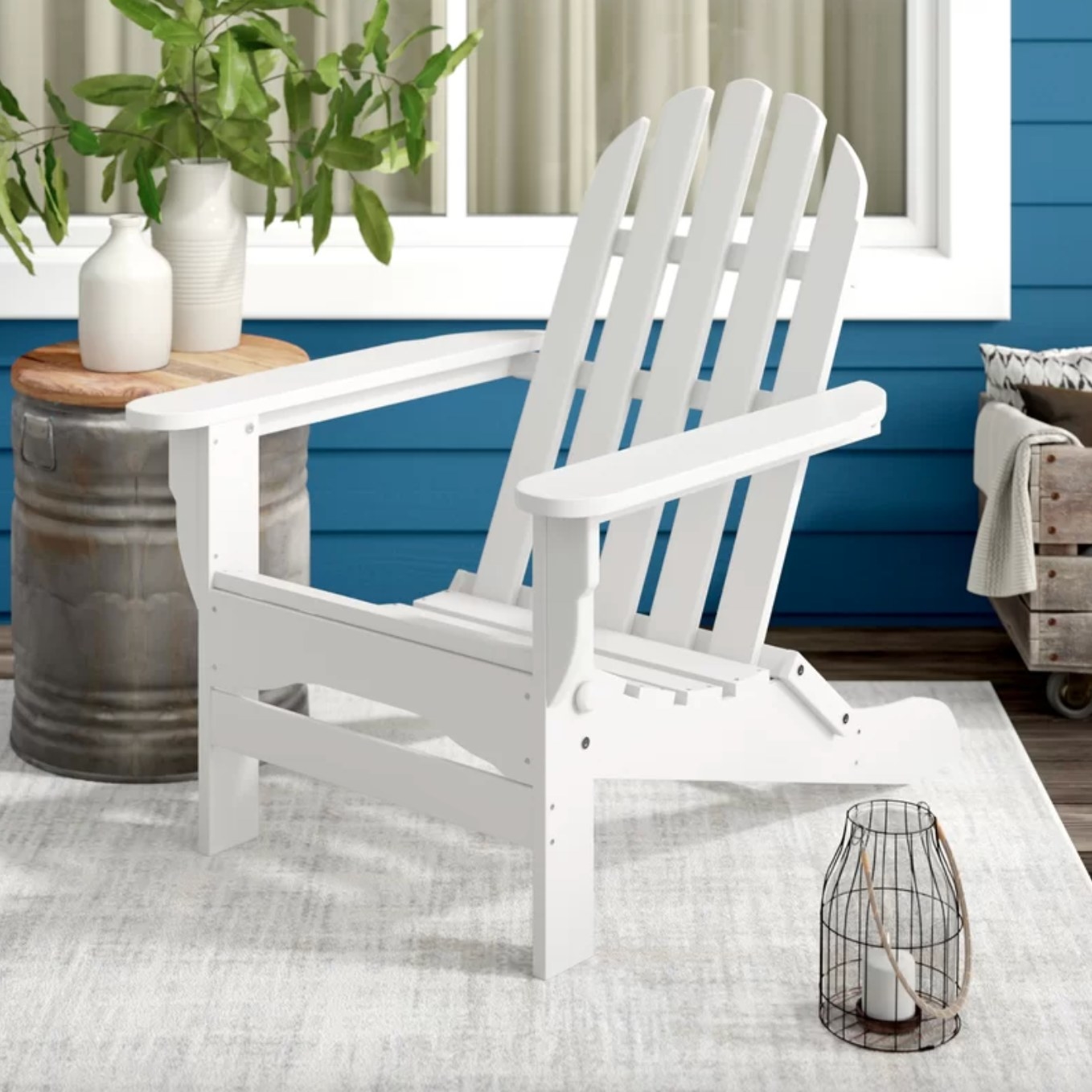 the white adirondack chair in a decorated deck space
