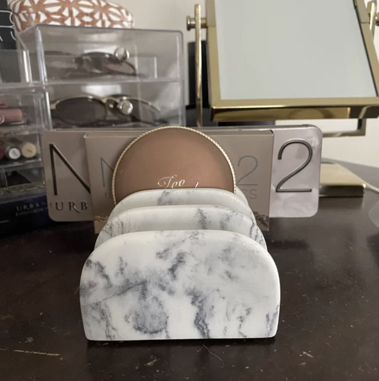 Reviewer's palette organizer with three Naked eyeshadow palettes