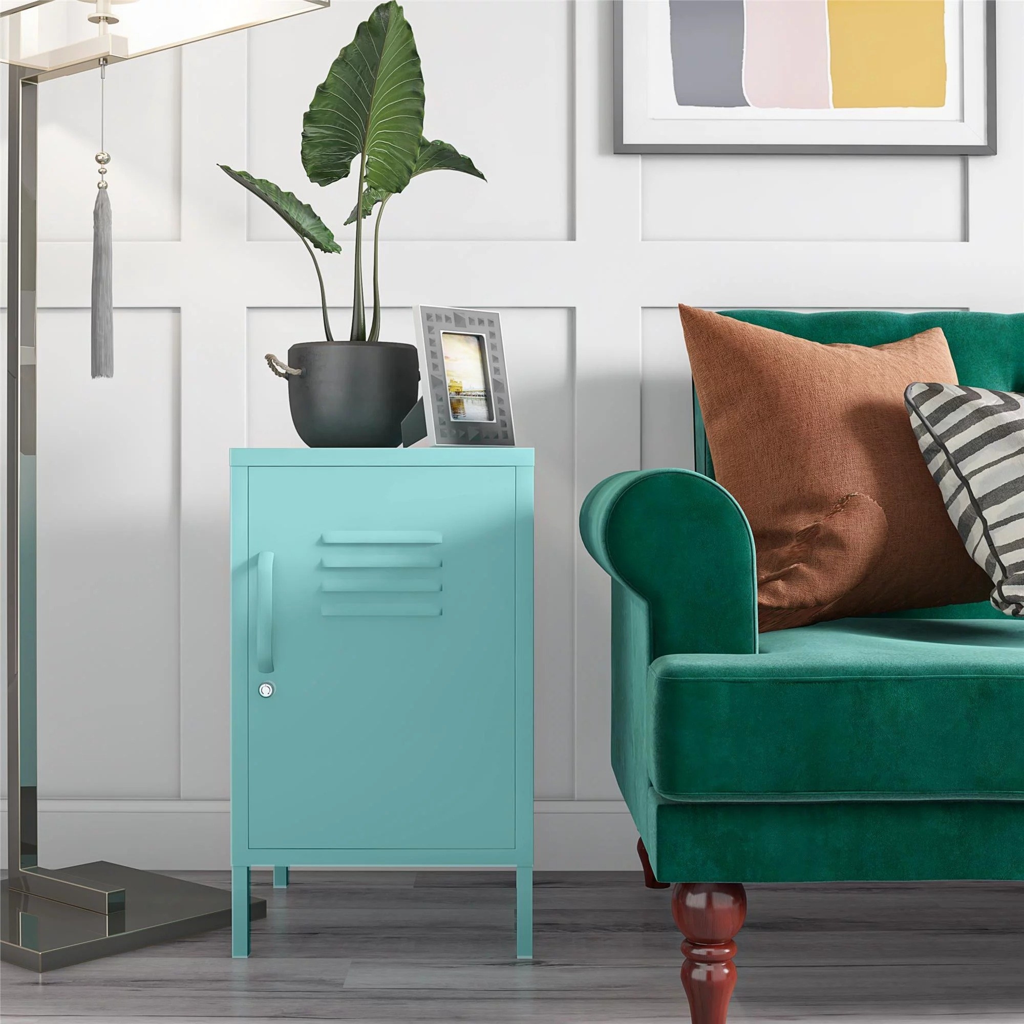 Turqoise locker-style end table next to green couch
