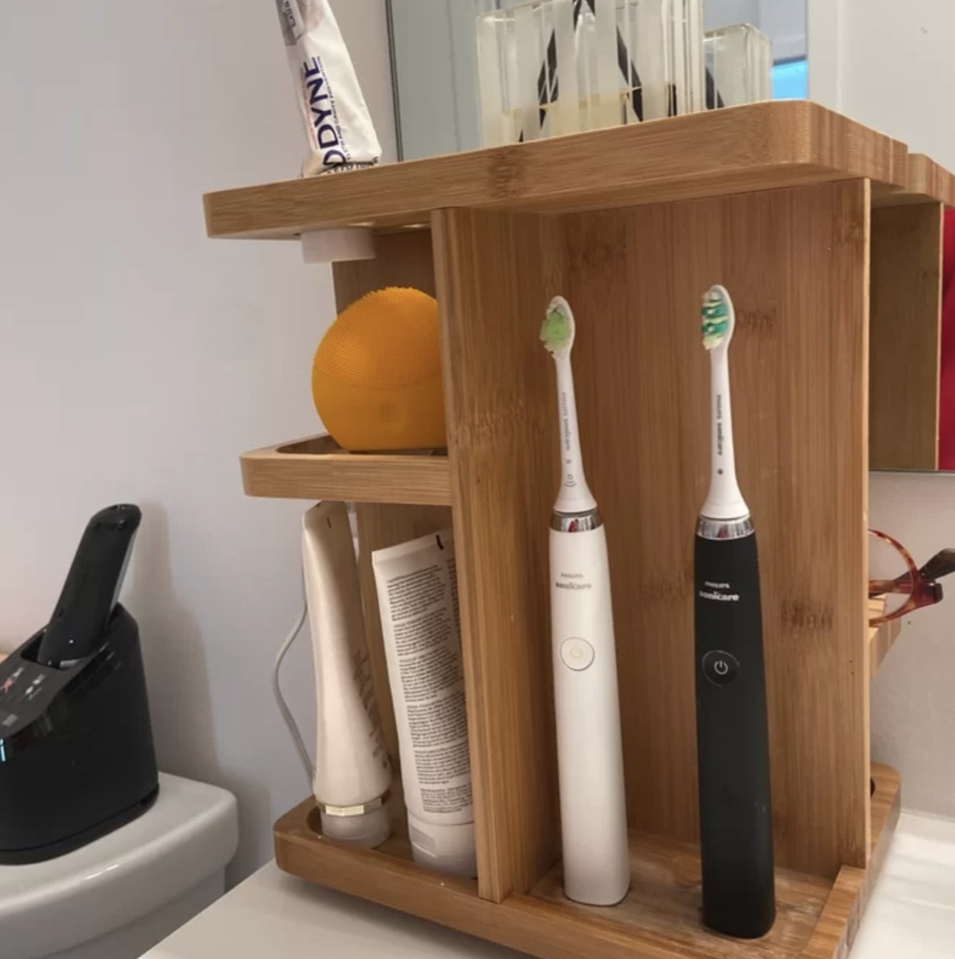Reviewer's organizer with toothbrushes and skincare products and devices