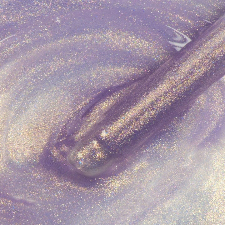 the consistency of the elixir showing it's dewy iridescent shimmer