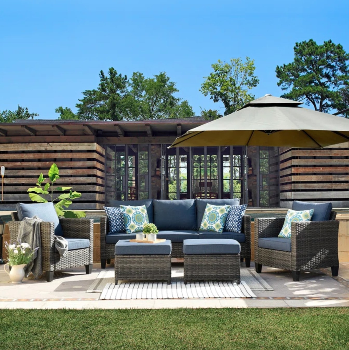 the navy and dark wicker set on a decorated patio space