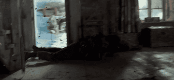 Two people attempt to avoid explosive gunshots when their home is under siege